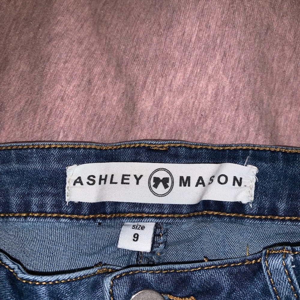 Medium denim jeans with holes at knees